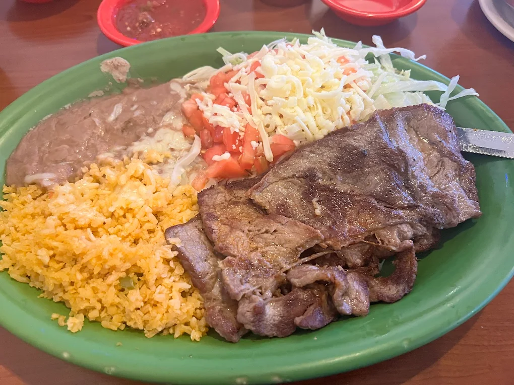 Crispy tortilla chips with fresh guacamole and salsa